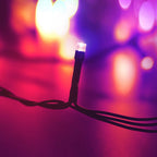 Modee Lichterkette 10m 100 LED Multicolor Kunststoff grün 3,6W 360° IP44 220-240V Netzstecker 8 Funktionen